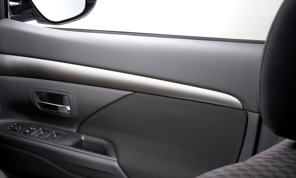 Interior view of a Mitsubishi SUV PHEV showcasing the Brushed Alloy Accent Panel