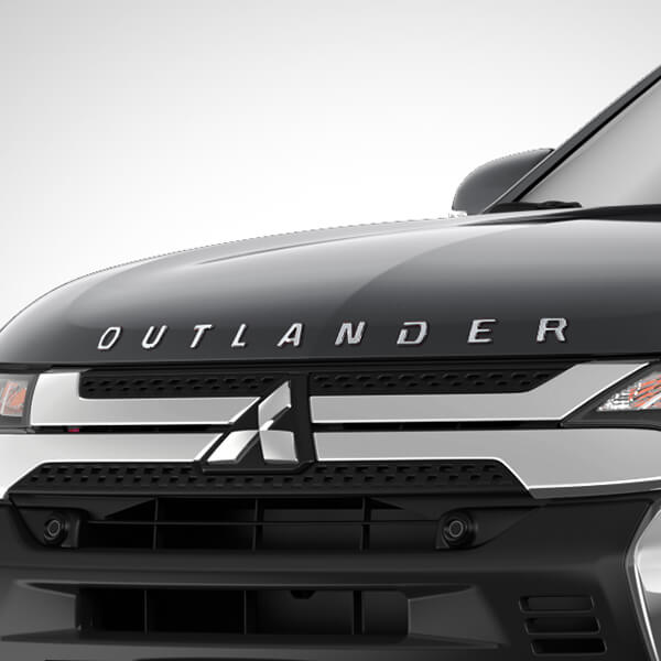 Close up front view image of the Mitsubishi Outlander showcasing the stylish Outlander Bonnet Badge.
