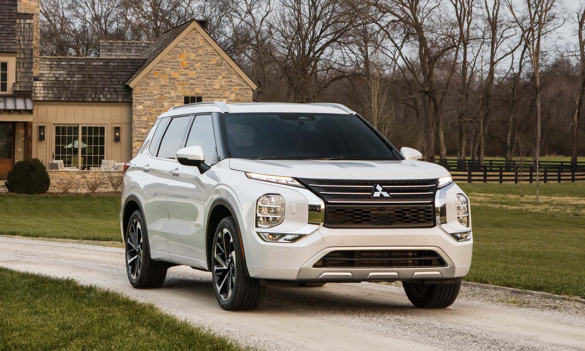 Image of Mitsubishi 2022 Outlander in front of a country-style house