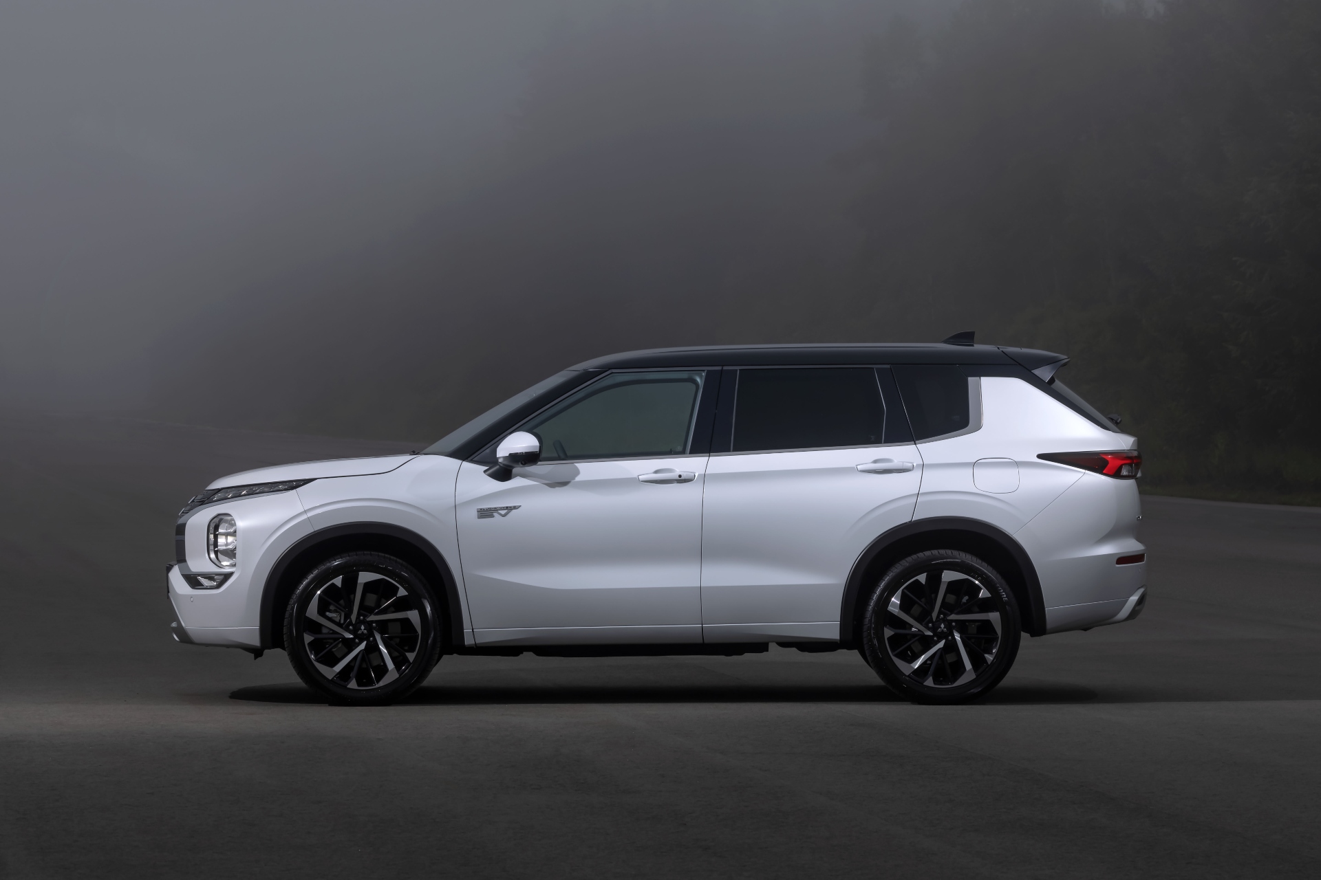 White 2020 PHEV Outlander side profile with edited grey background