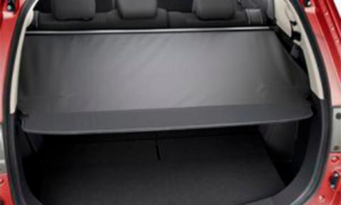 Rear interior view of the Cargo Blind covering the trunk of an open trunk door of the Mitsubishi SUV PHEV.
