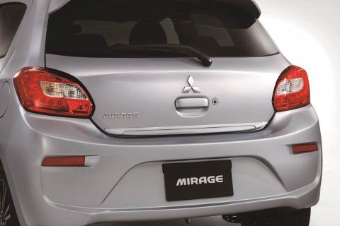 Chrome tailgate garnish for Mitsubishi Mirage, attached to hatch, and seen from rear of car