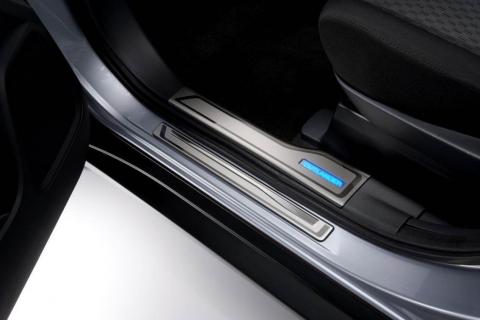 Close up interior image of the elegant blue Illuminated Scuff Plate in the Mitsubishi Outlander PHEV.
