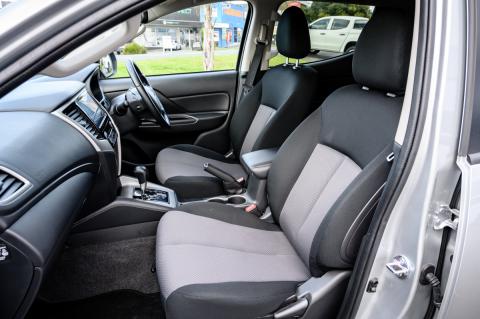 An interior shot of the front seats of a Mitsubishi Triton