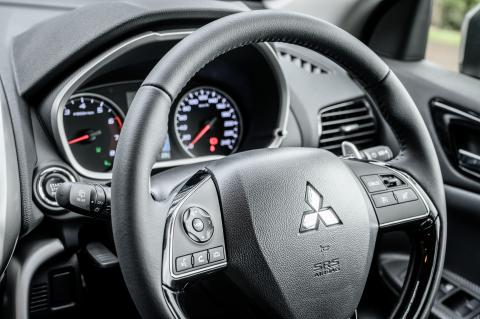 A close up shot of a Mitsubishi Eclipse Cross steering wheel