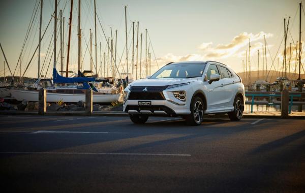 An Eclipse Cross PHEV parked at a marina
